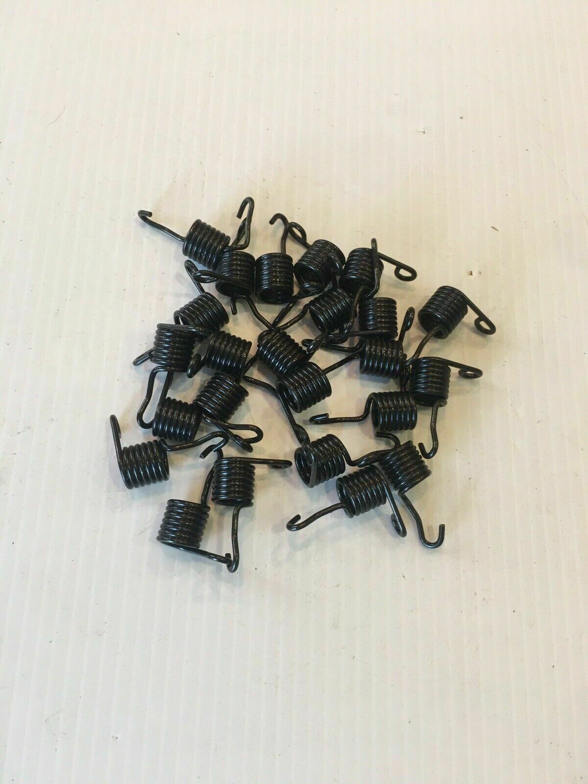 Springs: 1958 - 1962 Corvette Headlight Bulb retaining ring springs 24